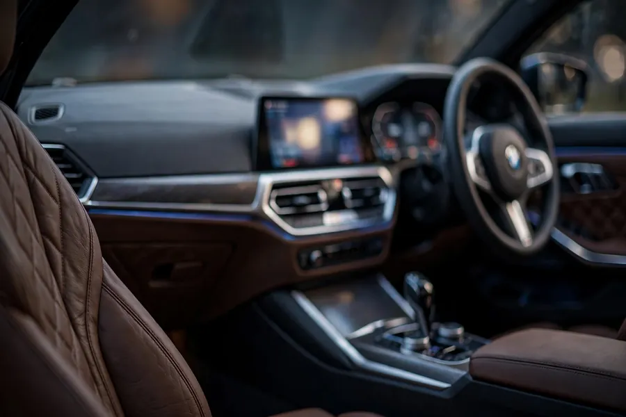 Modern BMW 3 Series cockpit with digital instrument cluster and central infotainment display