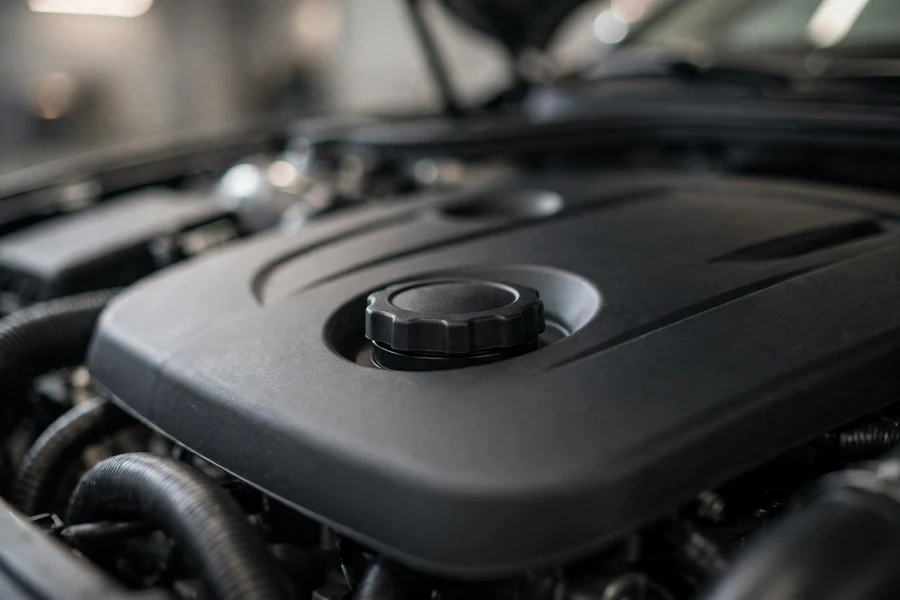 A clean engine bay with the oil filler cap — the oil system feeds the turbo, timing chain and VANOS, which is why interval discipline matters
