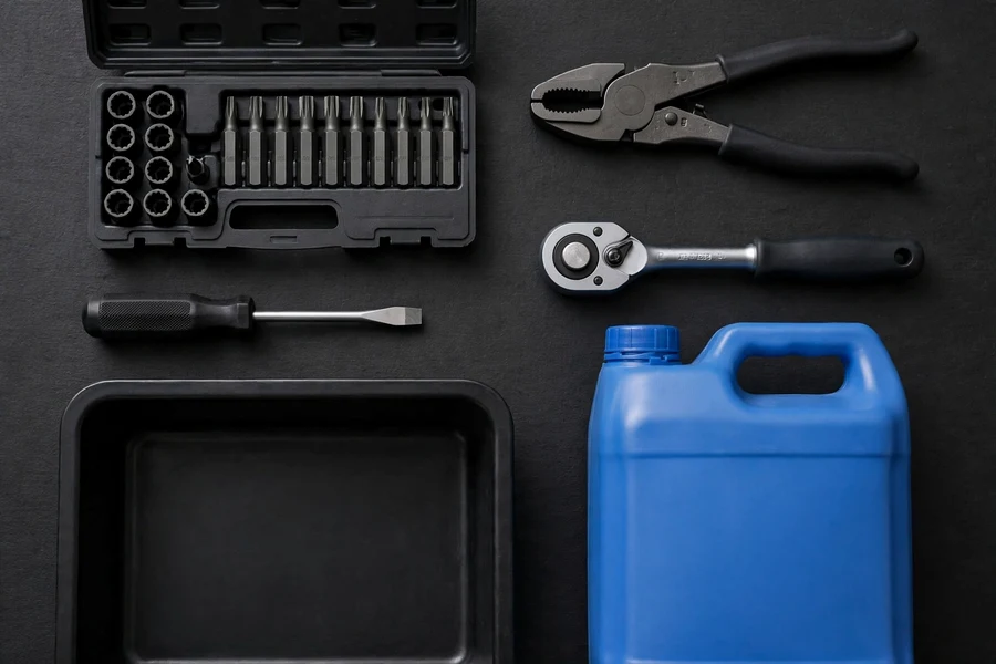 Torx bit socket set, ratchet, pliers, screwdriver, coolant jug, and drain pan laid out for a radiator replacement