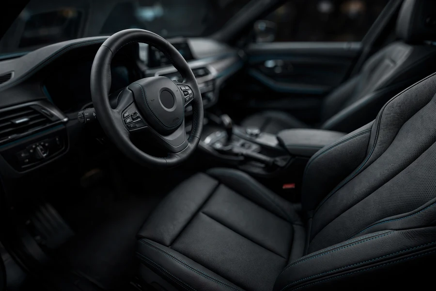 M sport leather steering wheel and sport seats in a BMW 3 Series cockpit