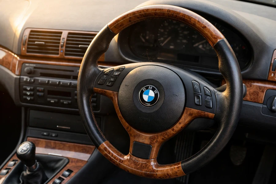 BMW E46 3 Series interior with wood-trim steering wheel
